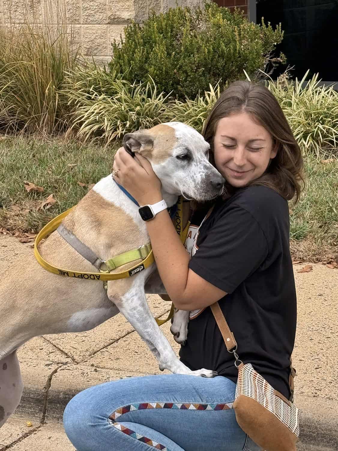Volunteer with a foster dog